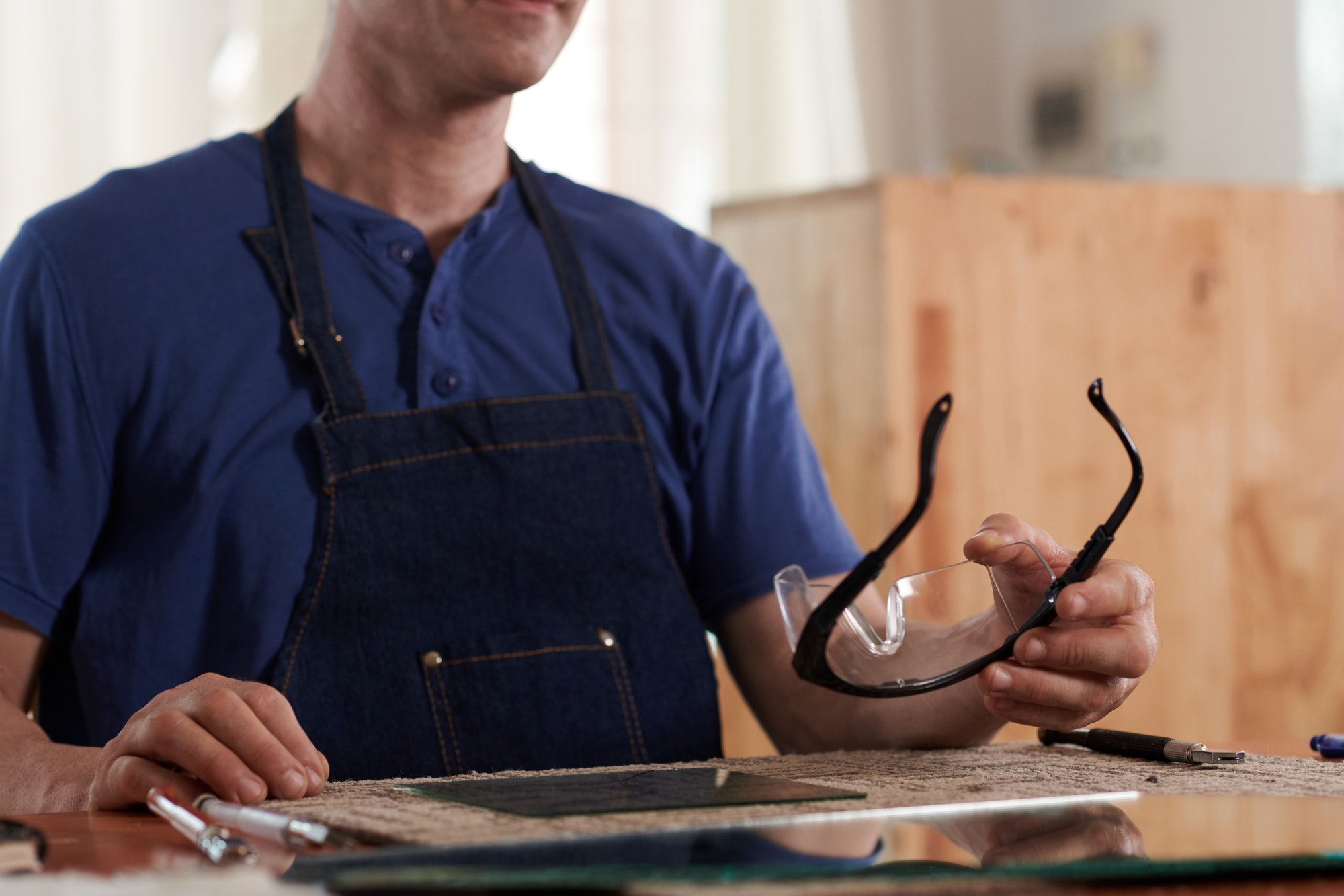 Worker using protective glasses at his work